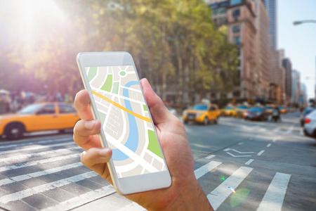 44885808 - man using map app on phone against new york street